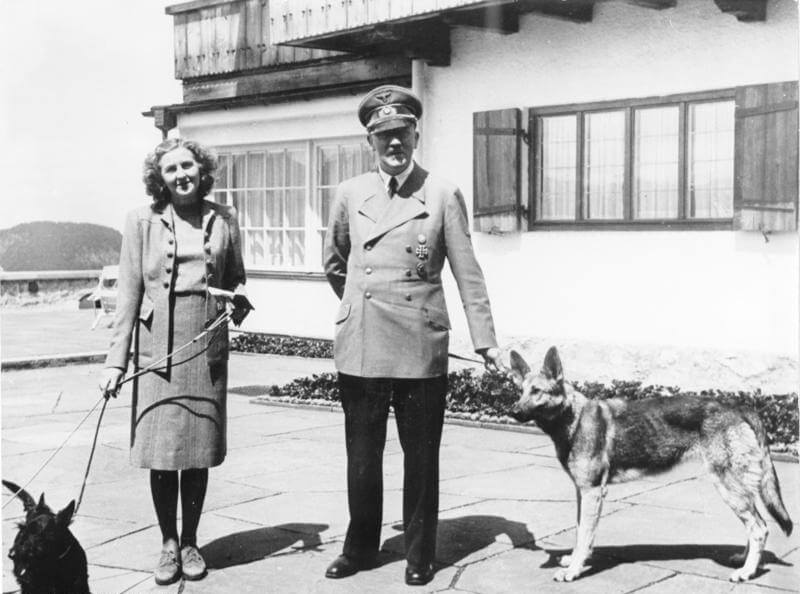 Adolf Hitler, Eva Braun, and their dogs.
